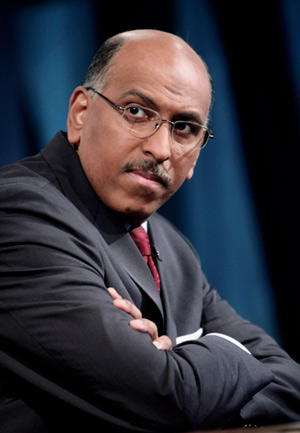 Michael Steele with arms folded