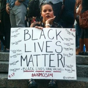 Woman with Black Lives Matter placard