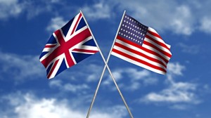 UK and US flags crossed - sky bkgrd